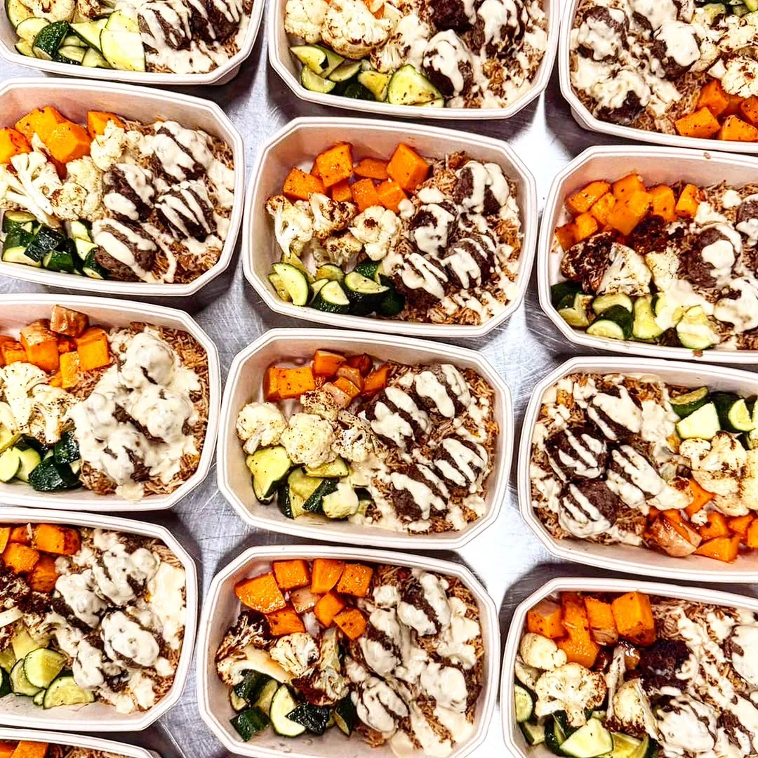 Roasted cauliflower and chickpea bowl with sweet potato, zucchini and tahini