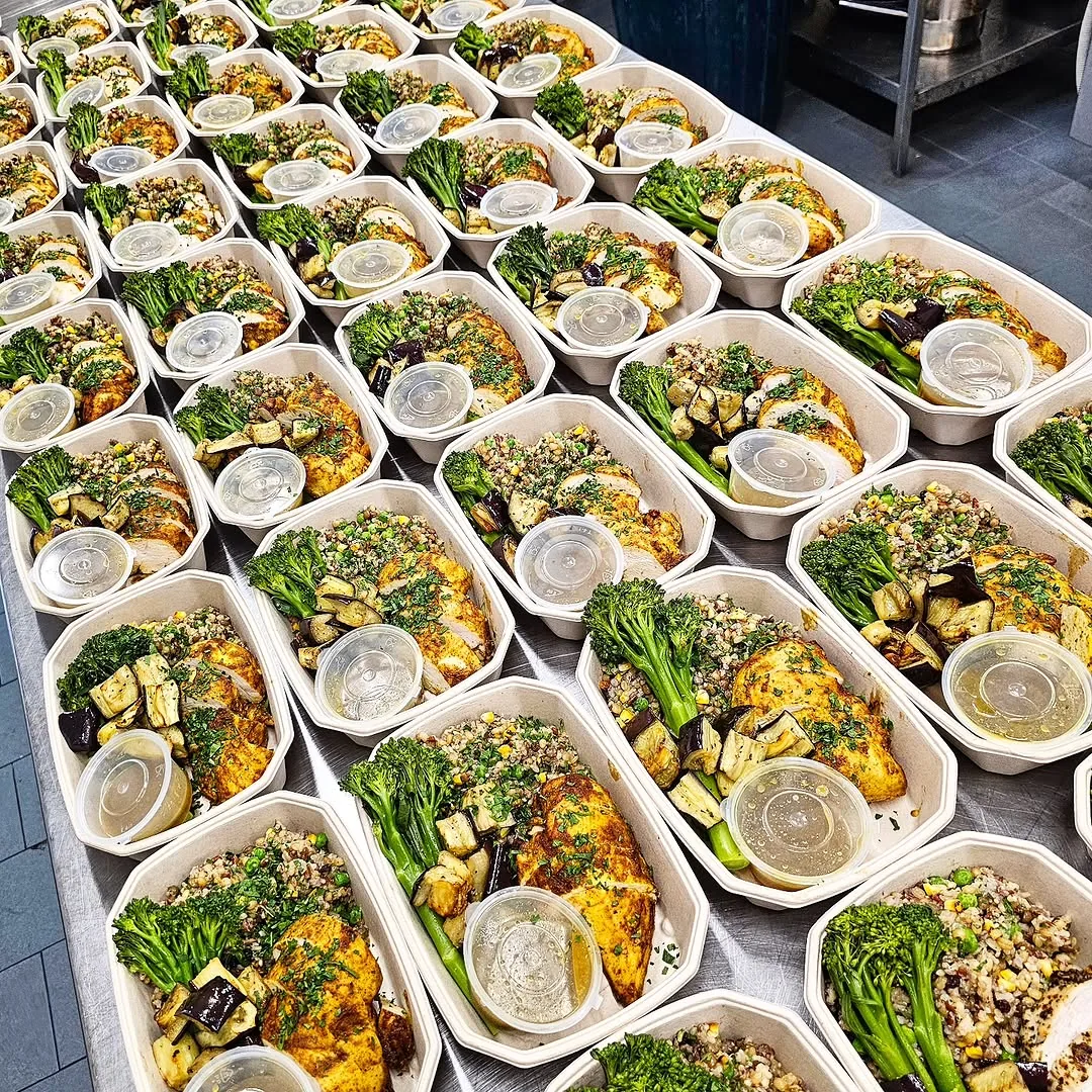 Sliced chicken with charred broccolini, roasted eggplant and grain salad